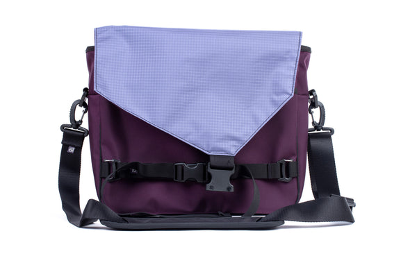 The Maker's Bag in Aubergine (dark purple) Ballistic with Dusk (blue-grey) Cerylon interior.